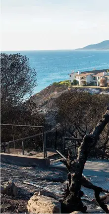  ??  ?? CLOCKWISE FROM TOP: LA County firefighte­rs in Malibu Creek State Park fighting the Woolsey Fire; a house burns in Malibu; the ruins of an oceanview house, with burning homes in the distance.