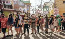  ?? JES AZNAR/NEW YORK TIMES ?? Voters line up at a polling place Monday in Manila. Filipinos voted in a hotly contested election that has been described as the most consequent­ial in decades, one that will shape the direction of the country’s fragile democracy.