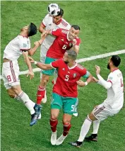  ?? AP ?? Romain Saiss (centre) of Morocco goes for a header during their Group ‘B’ match against Iran at the St Petersburg Stadium on Friday.