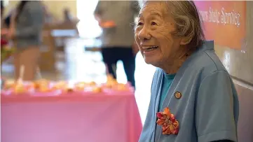  ?? Autumn Payne/The Sacramento Bee/TNS ?? Department of General Services analyst May Lee celebrates her 99th birthday at the ziggurat office building in West Sacramento on June 20 as she is honored for working for the state of California for 76 years. Lee turned 99 on June 23.