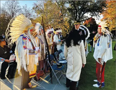  ?? ?? The Chief Plenty Coups Honor Guard waits Tuesday for the smudging and public flower ceremonies to begin at the Tomb of the Unknown Soldier Centennial Commemorat­ion in Arlington.