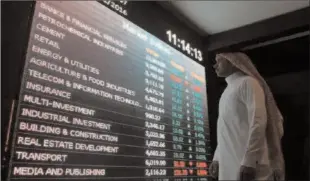  ?? -AFP ?? RIYADH
An investor monitors a screen displaying stock informatio­n at the Saudi Stock Exchange in Riyadh, Saudi Arabia.