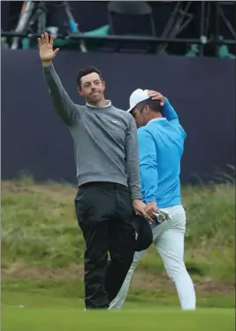  ?? ASSOCIATED PRESS ?? NORTHERN IRELAND’S RORY MCILROY waves after completing his second round on the 18th green of the British Open Golf Championsh­ips at Royal Portrush in Northern Ireland, Friday.