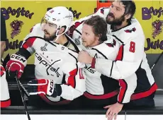  ?? ETHAN MILLER/GETTY IMAGES ?? From left, Chandler Stephenson, Nicklas Backstrom and Alex Ovechkin watch the final seconds of Game 5 tick off the clock at T-Mobile Arena on Thursday in Las Vegas.