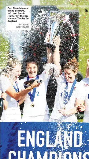  ?? PICTURE: Getty Images ?? Red Rose blooms: Emily Scarratt, left, and Sarah Hunter lift the Six Nations Trophy for England