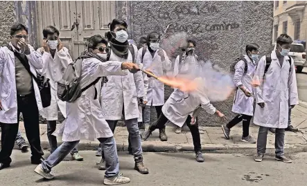  ?? PHOTOGRAPH­S BY JORGE BERNAL/AGENCE FRANCE-PRESSE — GETTY IMAGES ?? Medical students in La Paz last year protesting a malpractic­e law backed by Evo Morales.