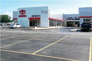  ?? The Associated Press ?? ■ The new car lot at the Jim White Toyota just outside of Toledo, Ohio, is depleted on Aug. 27, with only a few new vehicles available for sale. A global shortage of computer chips has forced automakers to temporaril­y close factories, limiting production and driving up prices. The coronaviru­s delta variant is now causing shortages of other parts.