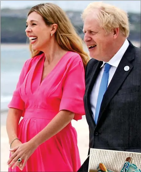  ??  ?? SHOWING A BUMP? Carrie and Boris in Cornwall. Right: The picture of a pram Christmas tree ornament she posted on Instagram