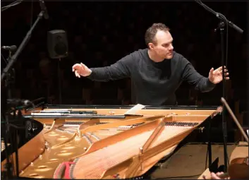  ?? ANNA VOGT VIA THE NEW YORK TIMES ?? In a family photo, the conductor Lars Vogt. For one of his final albums made before dying from cancer, Vogt turned to chamber music by Schubert with Christian and Tanja Tetzlaff.