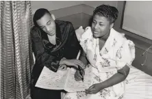  ?? Eagle Rock / Redferns ?? Bandleader Chick Webb and his protege Fitzgerald are seen going over music charts in the documentar­y.