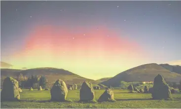  ??  ?? Castlerigg Stone Circle by Matthew James Turner. This was Turner’s first encounter with the aurora borealis in Keswick, Cumbria. The moon illuminate­d the foreground of standing stones and the aurora surfaced from behind the mountains.