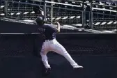  ?? JAE C. HONG — THE ASSOCIATED PRESS ?? Tampa Bay Rays right fielder Manuel Margot reaches over a right field wall after catching a foul ball by Houston Astros center fielder George Springer during the second inning in Game 2 of the ALCS on Monday.