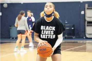  ?? COURTESY ?? American Heritage student Khadee Hession wears a “Black Lives Matter”shirt at a basketball warm-up last week.