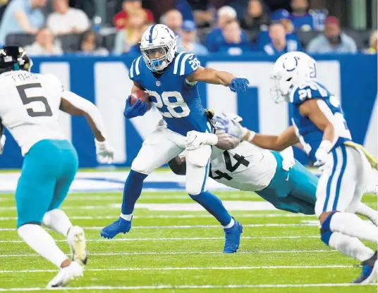  ?? AJ MAST/AP ?? Jonathan Taylor runs against the Jacksonvil­le Jaguars in the second half on Sunday.