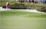  ?? AP JULIO CORTEZ ?? Justin Thomas reacts after missing a shot from a bunker on the 16th hole during the four-ball golf matches on the second day of the Presidents Cup at Liberty National Golf Club in Jersey City, N.J., Friday.