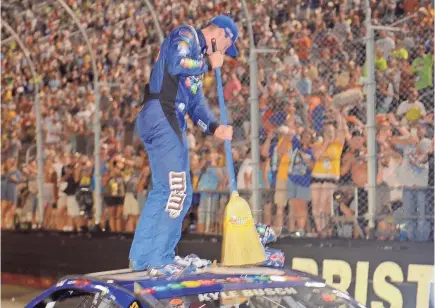  ?? RANDY SARTIN/USA TODAY SPORTS ?? Kyle Busch breaks out the broom after sweeping NASCAR’s three races at Bristol last August.