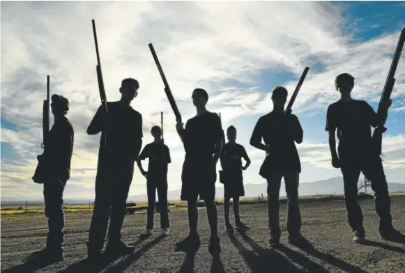  ?? Helen H. Richardson, The Denver Post ?? Seven members of the St. Mary’s High School competitiv­e shooting team stand for a portrait holding their shotguns after practice at the Pikes Peak Gun Club in Colorado Springs on Wednesday. The team has 17 members. St. Mary’s is the only Colorado high...