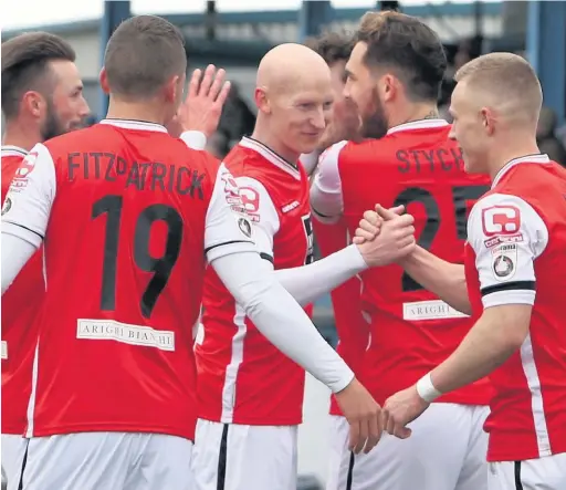  ?? Peter Hilton Photograph­y ?? ●● Macclesfie­ld players celebrate Danny Whitehead’s goal at Barrow at the weekend