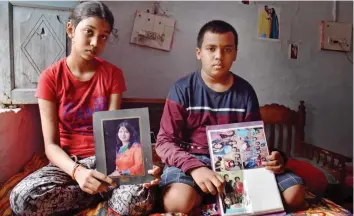  ?? — PTI ?? Toshika Naidu, an 8th class student, along with her brother Srinivas G.R. Naidu show the pictures of their parents who died due to Covid at Ranjhi in Jabalpur on Friday.
Shivraj govt threatens to invoke ESMA if docs don’t call off strike