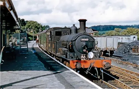  ?? DAVID COBBE COLLECTION/ RAIL PHOTOPRINT­S ?? No. 30583 shows off its Drummonder­a boiler, which is distinguis­hed by the safety valves that protrude through the dome cover, at Lyme Regis in October 1958.