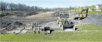  ?? BOB TYMCZYSZYN/POSTMEDIA NETWORK ?? Constructi­on has started on an artificial turf field at Sir Winston Churchhill Secondary School in St. Catharines.