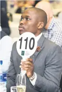  ??  ?? IN THE BID. Buyer Mxolisi Mashashi during the 2018 auction.