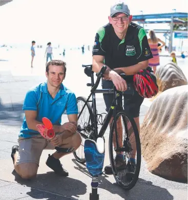  ?? Picture: STEWART McLEAN ?? PUMPING PEDALS: Mike Shaw, pictured with Jerry Vella from Freedom Prosthetic­s (left). will ride from Cairns to Sydney to raise money for the AmpCamp.