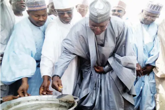 ??  ?? . Governor Sule Lamido of Jigawa (2nd right), laying the foundation for the Senate Building of Jigawa State University at Kafin-Hausa, yesterday. Pic: NAN