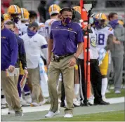  ?? AP PHOTO BY MICHAEL WOODS ?? LSU coach Ed Orgeron walks on the sidelines against Arkansas during the second half of an NCAA college football game Saturday, Nov. 21, 2020, in Fayettevil­le, Ark.