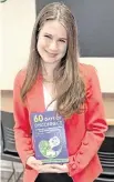  ?? Photo courtesy of Keegan Lee ?? Keegan Lee holds “60 Days of Disconnect,” a book she co-wrote at the age of 16 with Elon University psychology professor Bilal Ghandour. The book follows her two-month journey without social media.