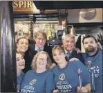  ??  ?? PRE-MATCH DRINK Portsmouth FC director Eric Eisner with staff at the Milton Arms in Portsmouth, where he enjoyed a pint of beer ahead of the Pompey v Southampto­n match