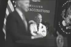  ?? ASSOCIATED PRESS ?? DIRECTOR OF THE NATIONAL INSTITUTE of Allergy and Infectious Diseases Dr. Anthony Fauci listens as President Joe Biden speaks during an event to commemorat­e the 50 millionth COVID-19 shot, in the South Court Auditorium on the White House campus in Washington on Thursday.