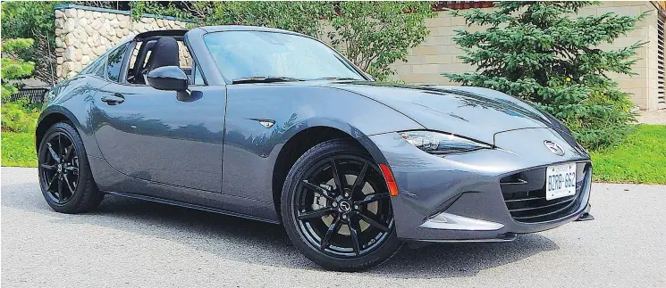  ?? BRIAN HARPER/DRIVING ?? The 2019 Mazda MX-5 RF has a folding hardtop, which, compared to the soft-top version, can be driven in a wider variety of climate conditions.