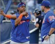  ?? JULIE JACOBSON — THE ASSOCIATED PRESS ?? New York Mets’ Yoenis Cespedes, left, talks with manager Mickey Callaway (36) before a baseball game against the New York Yankees, Friday in New York.
