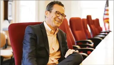  ?? Tyler Sizemore / Hearst Connecticu­t Media ?? University of Maine Chancellor Dannel Malloy, the former governor of Connecticu­t, chats in the executive offices at the main campus in Orono, Maine in 2019.