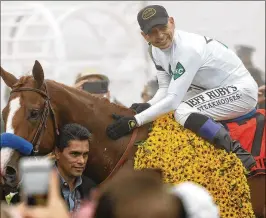  ?? ROB CARR / GETTY IMAGES ?? “He got a little tired,” jockey Mike Smith said after Justify held off Bravazo and Tenfold in Saturday’s Preakness. “This is his hardest race that he’s had.”