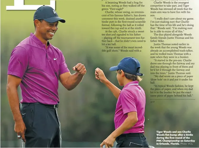  ?? Photo: VCG ?? Tiger Woods and son Charlie Woods fist- bump after a birdie during the first round of the PNC Championsh­ip on Saturday in Orlando, Florida.