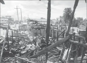  ??  ?? The remains of the Vreed-en-Hoop, West Bank Demerara buildings after Sunday morning’s fire.