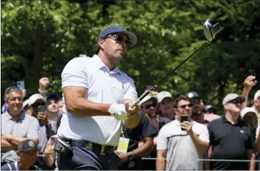  ?? AP PHOTO/CHARLES KRUPA ?? Phil Mickelson watches his shot on the 15th hole during a practice round for the U.S. Open golf tournament at The Country Club, Wednesday, June 15, 2022, in Brookline, Mass.