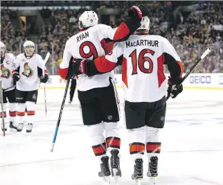  ?? MADDIE MEYER/GETTY IMAGES ?? Bobby Ryan celebrates with Clarke MacArthur after scoring against the Boston Bruins during the second period on Sunday in Boston. MacArthur was the best player on either team all day.