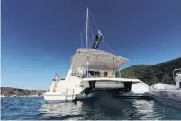  ??  ?? Secret . . . Our catamaran, moored in the Caribbean during a snorkel break.