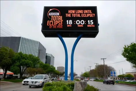  ?? TONY GUTIERREZ — THE ASSOCIATED PRESS ?? Informatio­n regarding the total solar eclipse is shown on a digital bill board as drivers make their way down a busy road in Addison, Texas, Thursday, March 21, 2024.