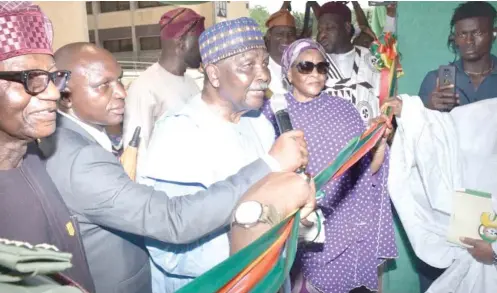  ?? Photo: Maureen Onochie ?? „ Former Head of State, Gen. Yakubu Gowon (middle) with others during the commission­ing of the NYSC ICT Centre in Abuja yesterday