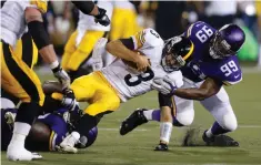  ?? AP PHOTO ?? AND SO IT BEGINS: Minnesota lineman David Yankey takes down Pittsburgh quarterbac­k Landry Jones during last night’s Hall of Fame Game in Canton, Ohio.