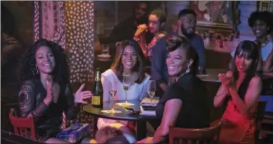  ?? MICHELE K. SHORT — UNIVERSAL PICTURES VIA AP ?? This image released by Universal Pictures shows, from left, Tiffany Haddish, Regina Hall, Queen Latifah and Jada Pinkett Smith in a scene from the comedy “Girls Trip.”