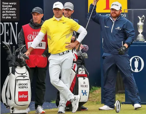  ?? REX ?? Time warp: Koepka (left) waits as Holmes gets ready to play