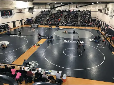  ?? JOHN ARMATO - POTTSTOWN ATHLETICS ?? Wrestling action gets under way at the District 1-3A North tournament at Pottstown Friday night. The tournament continues through Saturday.