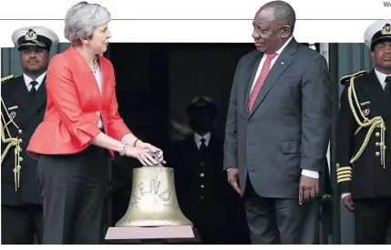  ?? / MIKE HUTCHINGS / POOL / AFP ?? Britain Prime Minister Theresa May and President Cyril Ramaphosa take part in the ceremony to hand over the bell of the SS Mendi in Cape Town on Tuesday.