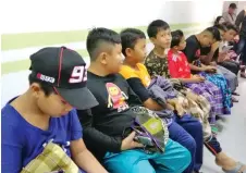  ??  ?? A section of the children wait for their turn during a mass circumcisi­on service by KPJ Kuching Specialist Hospital at Semariang.