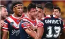  ?? Photograph: Chris Hyde/ Getty Images ?? Joey Manu of the Sydney Roosters after a tackle from Latrell Mitchell of the Rabbitohs during the round 24 NRL match at Suncorp Stadium.